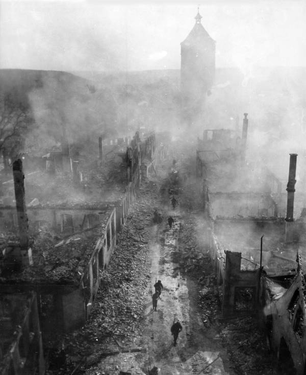 Women Walking Through Rubble in War-Torn Europe