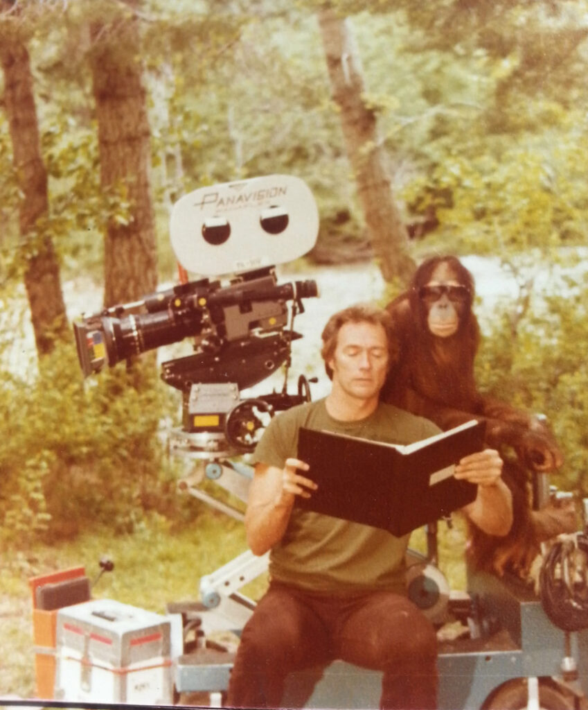 Clint Eastwood reading to Manis the orangutan on the set of Every Which Way But Loose