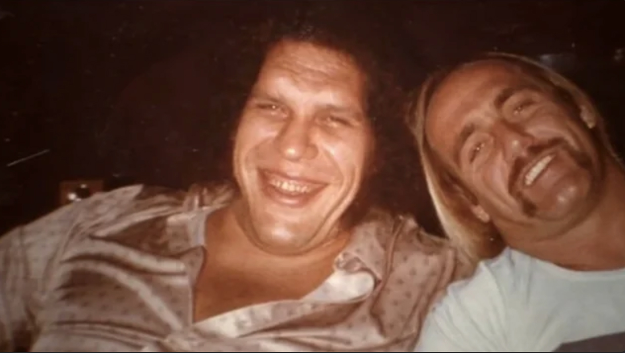 Andre the Giant and Hulk Hogan smiling (out of the wrestling ring)