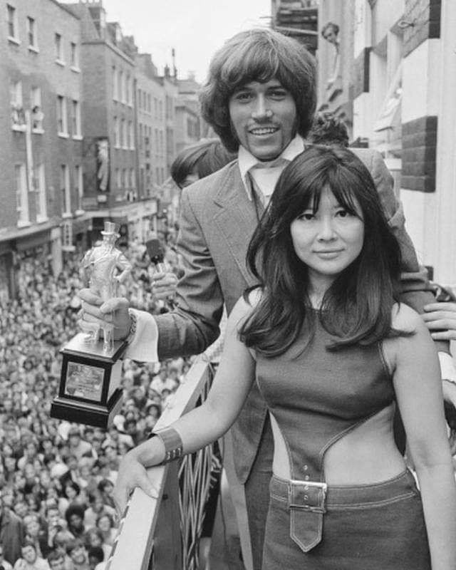 Barry Gibb of the Bee Gees receives an award for being Best Dressed Personality